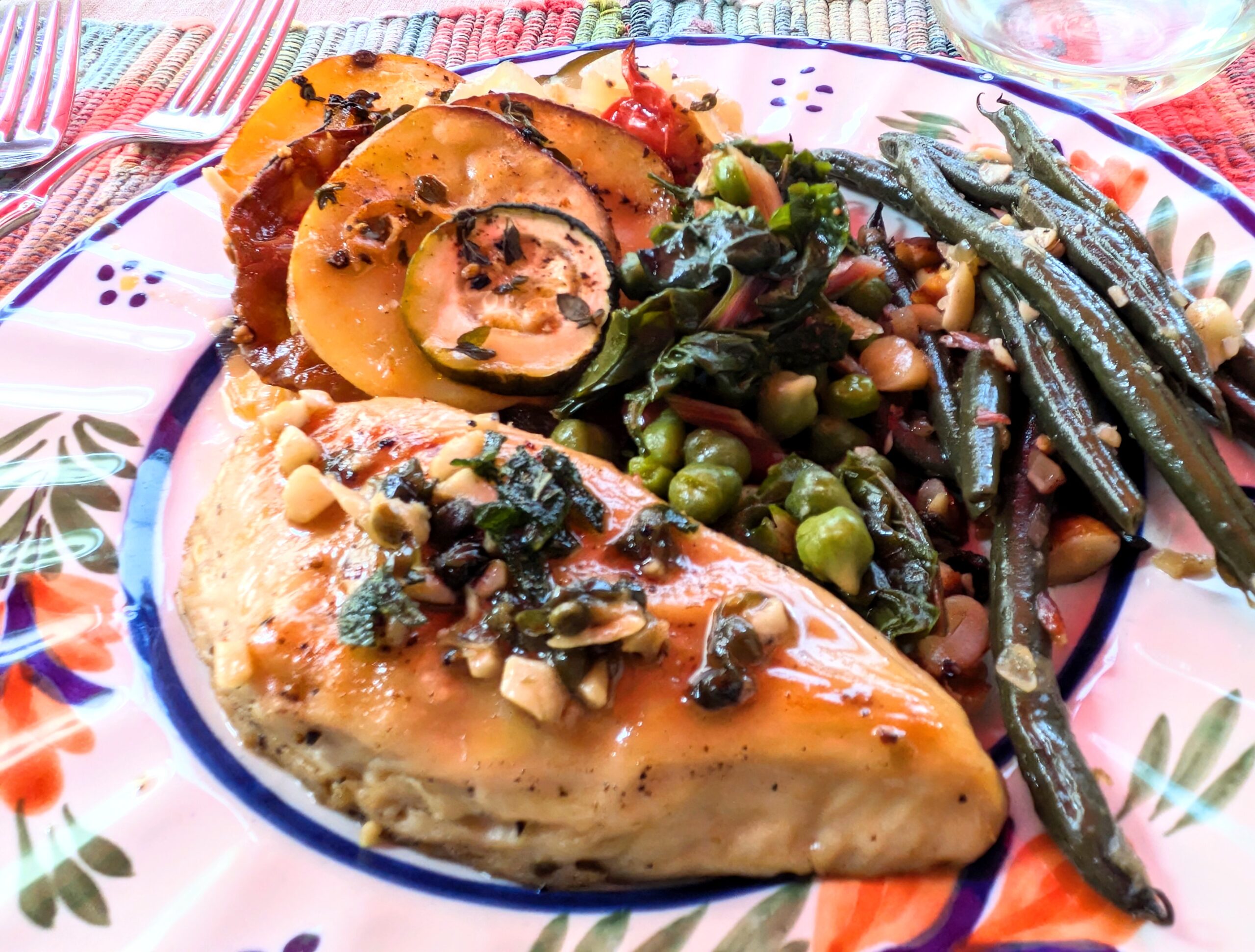 Golden-seared Swap plant-based chicken breast topped with white wine caper vegan butter sauce on a ceramic plate